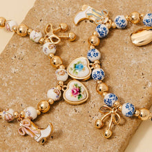 Load image into Gallery viewer, Western And Heart Charms Floral Ceramic Beaded Bracelet