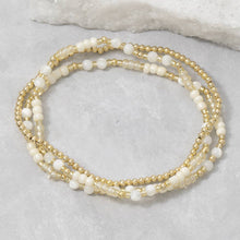 Load image into Gallery viewer, Shell Bead And Gold Stretch Layered Bracelet Set