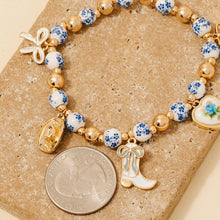 Load image into Gallery viewer, Western And Heart Charms Floral Ceramic Beaded Bracelet