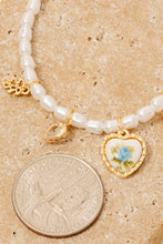 Load image into Gallery viewer, Floral Ceramic Heart And Bow Charms Pearl Beaded Bracelet