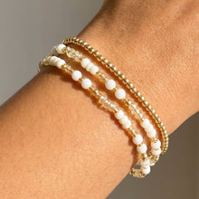 Load image into Gallery viewer, Shell Bead And Gold Stretch Layered Bracelet Set
